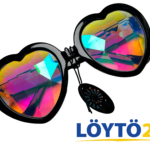 Sydämenmuotoiset GloFX Heart Kaleidoscope Glasses -lasit ja värikkäät sateenkaarikristallit.